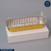 A clear plastic clamshell lid layered over a gold foil tray, displayed on a white rectangular block against a gray background.